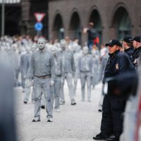 Participants march in the '1,000 figures' demonstration