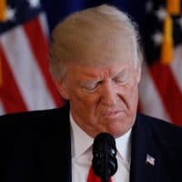 U.S. President Donald Trump reads from a prepared statement as he delivers remarks on the protests in Charlottesville, Virginia, from his golf estate in Bedminster, New Jersey U.S., August 12, 2017. REUTERS/Jonathan Ernst