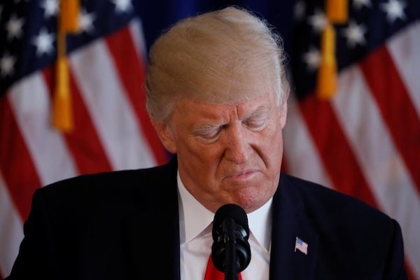 | US President Donald Trump reads from a prepared statement as he delivers remarks on the protests in Charlottesville Virginia from his golf estate in Bedminster New Jersey US August 12 2017 REUTERSJonathan Ernst | MR Online