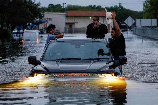 | Residents Using Truck To Navigate Through Flood Water | MR Online