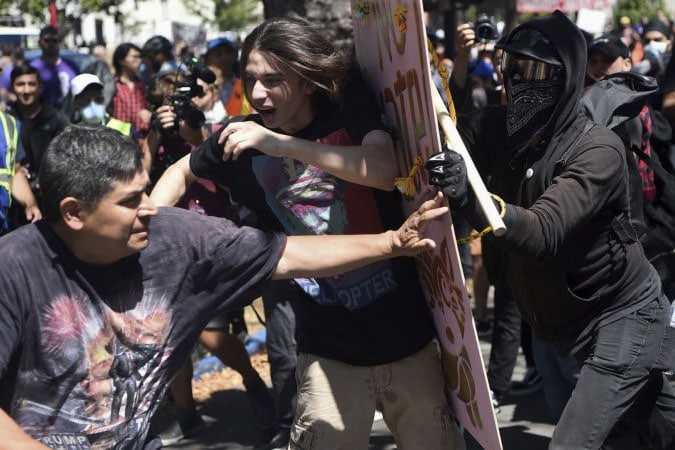 | Anti fascists push back against a fascist protestor with a Pinochet T shirt | MR Online