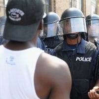 Police in riot gear stand by as protesters demonstrate following a not-guilty verdict in Police Officer Jason Stockley’s trial over shooting death of motorist Anthony Lamar Smith on Sept. 15, 2017, in St. Louis. (Michael B. Thomas/Getty Images)