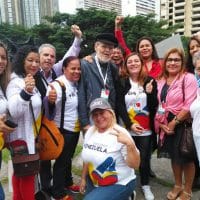 | International delegates gather with Venezuelan political theorist and historian Luis Britto Garcia center Jeanette CharlesVenezuelanalysis | MR Online