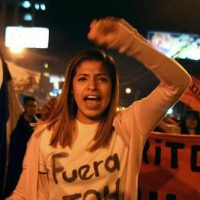 Girl in protest. Photo Credit: Deutsche Welle