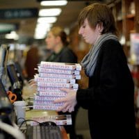 An employee holds copies of the book 'Fire and Fury: Inside the Trump White House'