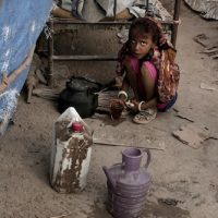 In this Feb. 15, 2018 photo, Awsaf, a thin 5-year-old who is getting no more than 800 calories a day from bread and tea, half the normal amount for a girl her age, drinks tea, in Abyan, Yemen. Nariman El-Mofty | AP