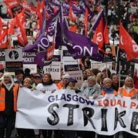 Strikers march to Glasgow Council's city chambers for a mass rally during a 48 hour strike by 8,000 GMB and Unison members over an equal pay claim