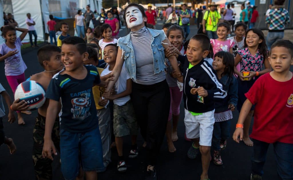 | A volunteer performs as a mime for Central American migrant children at the Jesus Martinez stadium in Mexico City Nov 6 2018 Rodrigo Abd | AP | MR Online