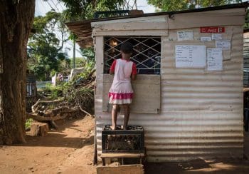 | 29 May 2018 A young child purchasing goods at a spaza shop in the Enkanini settle ment in Cato Manor Durban Madelene Cronjé New Frame | MR Online