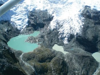 | Green and blue meltpools on the North Ama Dablam Glacier where the vanishing icefall has exposed the eroded bedrock below | MR Online