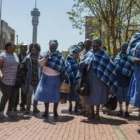 Residents of the Lesetlheng village community from the North West celebrating outside the Constitutional Court