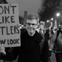 Protester's sign I don't like Hitler's new look