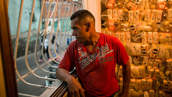 | A man stands next to a pile of subsidized food to be distributed under a Maduro government program named CLAP in the Catia district of Caracas Venezuela Jan 31 2019 An independent UN human rights monitor says economic sanctions are compounding a grave crisis in Venezuela Rodrigo Abd | AP | MR Online