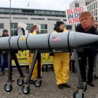 Activist with a mask of Donald Trump in a demonstration against nuclear weapons