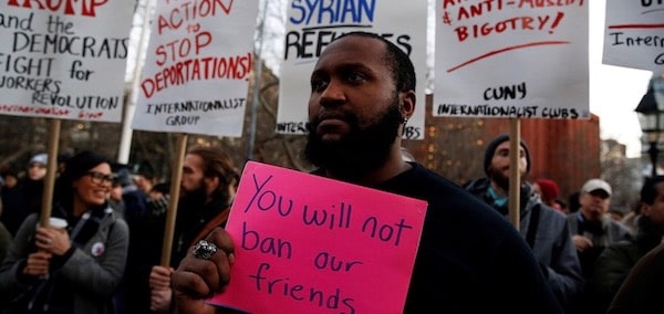 | Isaiah Dupree holds a sign as demonstrators gather at Washington Square Park to protest against US President Donald Trump in New York US January 25 2017 REUTERSShannon Stapleton RTSXDZB | MR Online