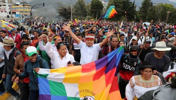 | Indigenous leader Jaime Vargas rises his arms during a protest against IMF austerity measures in Quito Ecuador Oct 8 2019 | Photo Reuters | MR Online