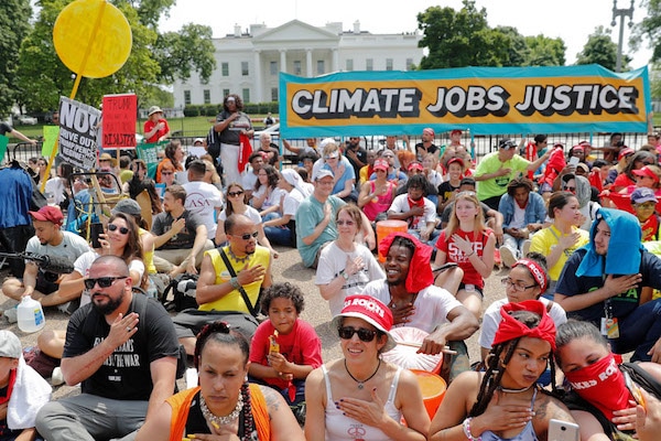 | Demonstrators sit on the ground in front of the White House April 29 2017 during a demonstration and march Thousands gathered across the country to march in protest of President Trumps environmental policies which have included rolling back restrictions on mining oil drilling and greenhouse gas emissions at coal fired power plants| Pablo Martinez Monsivais AP | MR Online