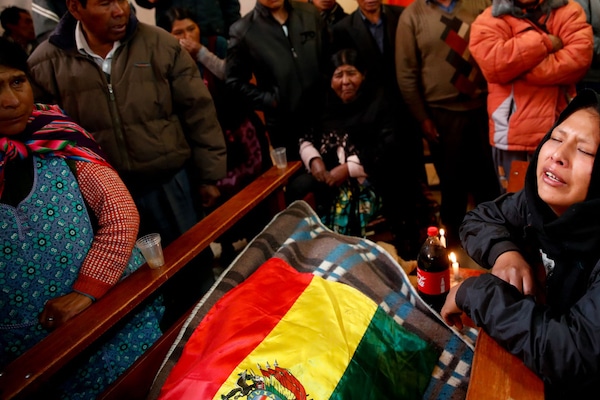 | Relatives mourn over the body of Antonio Quispe killed by security forces during a funeral at the San Francisco de Asis church in El Alto outskirts of La Paz Bolivia Nov 20 2019 Natacha Pisarenko | AP | MR Online