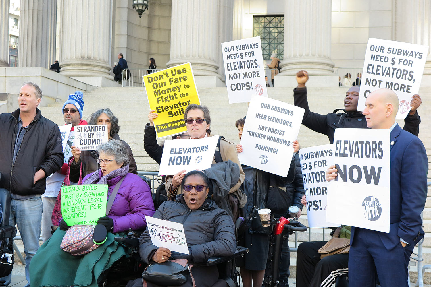 | Members of Peoples MTA Rise and Resists Elevator Action Group Disabled In Action and the Peoples Power Assemblies NYC protest at the base of the New York State Supreme Court Building | MR Online