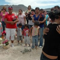 Unidentified people embrace during the funeral of Sergio Adrian Hernandez Huereka, 15, at the cemetery in Ciudad Juarez, Mexico, Thursday June 10, 2010. Mexico condemned the fatal shooting of Hernandez Huereka by a U.S. Border Patrol agent through diplomatic correspondence and some Mexican politicians called for the agent's extradition to face Mexican justice. (AP Photo)