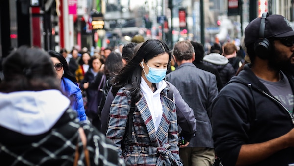 | A pedestrian wears a surgical mask on a busy street in mid town Manhattan as concerns grow around COVID 19 Tuesday March 3 2020 in New York A man from New York Citys suburbs was hospitalized in serious condition with COVID 19 on Tuesday a case that prompted school closings and quarantines for congregants of a now shuttered synagogue The states second confirmed case also raised the possibility that the virus is spreading locally AP PhotoBebeto Matthews | MR Online