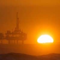 Offshore oil rig with sunset