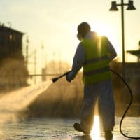 A worker sanitizes a street on the fourth day of an unprecedented lockdown across of all Italy