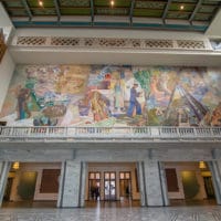 Oslo City Hall - The place where the Nobel Peace Prize is presented Oslo City Hall (Norwegian: Oslo rådhus) houses the city council, city administration, and art studios and galleries. The construction started in 1931, but was paused by the outbreak of World War II, before the official inauguration in 1950. Its characteristic architecture, artworks and the Nobel Peace Prize ceremony, held on 10 December, makes it one of Oslo's most famous buildings. It was designed by Arnstein Arneberg and Magnus Poulsson. The roof of the eastern tower has a 49-bell carillon which plays every hour. It is situated in Pipervika in central downtown Oslo. The area was completely renovated and rebuilt to make room for the new city hall, back in the late 1920s. In June 2005 it was named Oslo's "Structure of the Century" [Wikipedia.org]