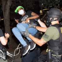 NLG Legal Observer arrested by Atlanta Police, June 1 (John Bazemore/AP).