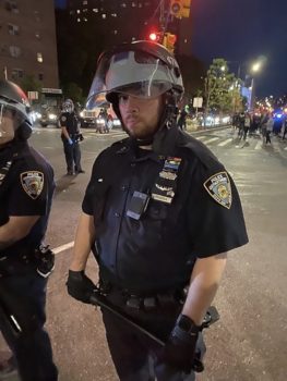 | New York City police officers lined up right off the Brooklyn Bridge on Brooklyn Bridge Boulevard on May 31 2020 in New York The officer shown has covered his badge number with a mourning band Photo Obtained by The Intercept | MR Online