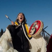 Chief Howilhkat, Freda Huson, and her sister Chief Geltiy, Brenda Michell, stand in ceremony while she waits for police to enforce Coastal GasLink’s injunction at Unist’ot’en Healing Centre near Houston, B.C. on Saturday, February 8, 2020. (Amber Bracken)