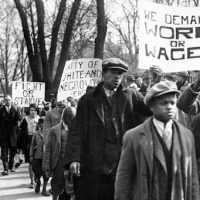 Work or Wages sign during demonstration