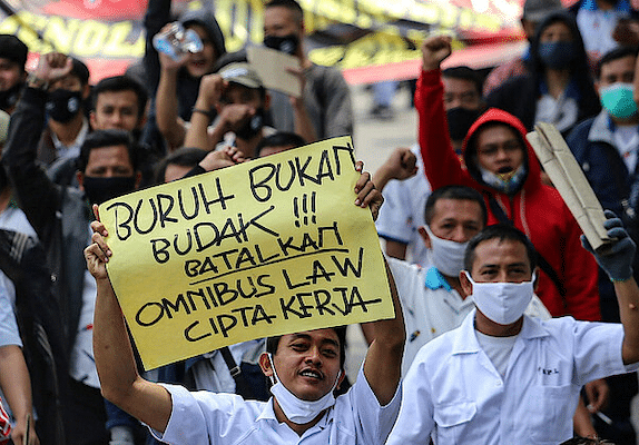 | An Indonesian trade unionist with a sign reading Labor is not a slave cancel the omnibus bill of job creation in Jakarta | MR Online