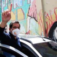 Andres Arauz, the presidential candidate for the political coalition National Union for Hope, UNES, flashes a number one finger sign as he leaves a press conference, in Quito, Ecuador, Jan. 13, 2021. Dolores Ochoa | AP