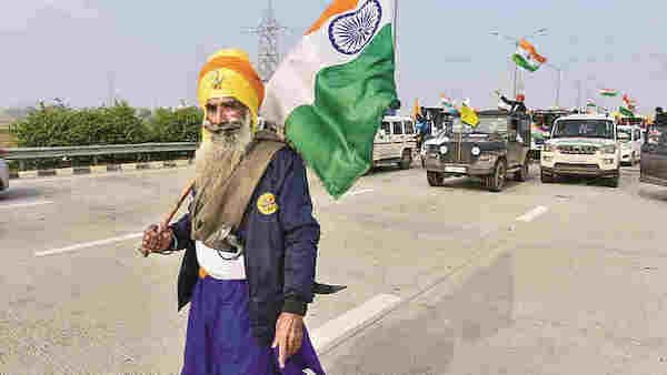 | A Nihang holds the Tricolor during farmers tractor rally as part of their ongoing protest against the new farm laws at Dankaur in Gautam Buddha Nagar District Thursday Jan 07 2021 PTI | MR Online