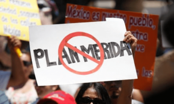 | A supporter of the peace caravan led by Mexican poet Javier Sicilia holds up a placard reading No to Merida Initiative during a rally in El Paso Texas in 2011 Source theguardiancom | MR Online