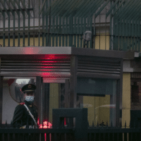 A Chinese paramilitary police officer stands guard outside the British Embassy in Beijing