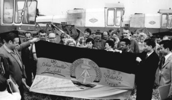 | Cooperative farmers handing over a flag of solidarity with the motto Solidarity Hastens Victory written on it to the Ambassador of the Democratic Republic of Vietnam 1972 | MR Online