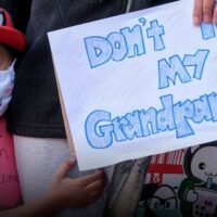 A 4-year-old boy holds a sign at a rally to raise awareness of anti-Asian violence, in Los Angeles, March 13, 2021. Ringo Chiu/AFP/People Visual