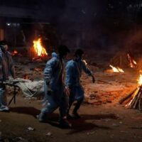 People carry the body of a man who died from COVID-19 at a crematorium in New Delhi, May 3, 2021. Photo: Reuters/Adnan Abidi