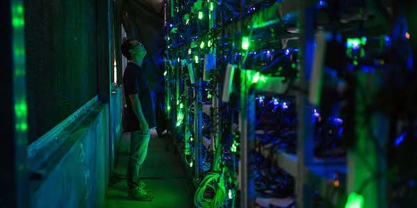 | A manager checks equipment at a Bitcoin mine near Kongyu Township Sichuan province Aug 12 2016 Paul RatjeThe Washington PostPeople Visual | MR Online