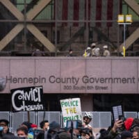 A mirror with Reflect painted on it by the group Visual Black Justice was installed in front of the Hennepin County Government Center in Minneapolis, Minnesota on the morning when Derek Chauvin's trial in the death of George Floyd was set to begin. (Flickr: Lorie Shaull)