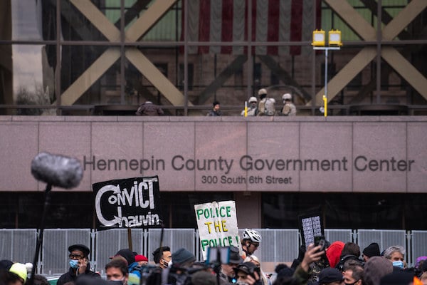 | A mirror with Reflect painted on it by the group Visual Black Justice was installed in front of the Hennepin County Government Center in Minneapolis Minnesota on the morning when Derek Chauvins trial in the death of George Floyd was set to begin Flickr Lorie Shaull | MR Online