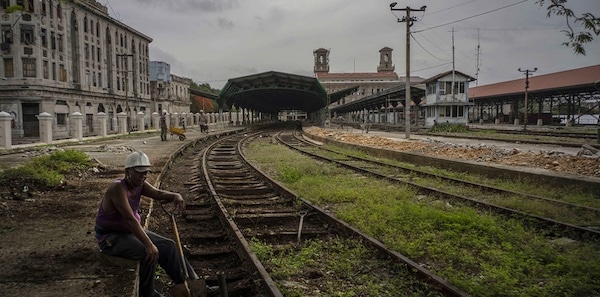 | A worker takes a breaks on the tracks of the Central Railway Station in Havana Cuba | MR Online