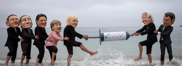 | Vaccine equity campaigners posing as the leaders of G7 nations tussle over a giant mock syringe on June 11 2021 near Falmouth Cornwall United Kingdom Photo Andrew AitchisonIn Pictures via Getty Images | MR Online