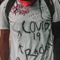 | Man in shirt with covid 19 George Floyd racism writing | MR Online