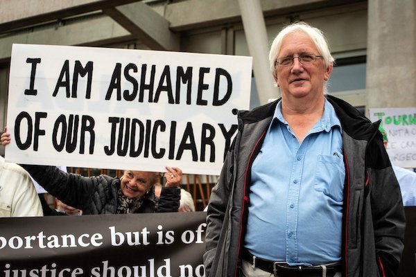 | Craig Murray poses with supporters outside the Scottish Parliament Photo The Scotsman | MR Online