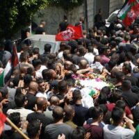 MOURNERS IN BEIT UMMAR CARRY THE BODY OF 11-YEAR-OLD MOHAMMED AL-ALAMI WHO WAS KILLED BY ISRAELI SOLDERIS WHILE ON HIS WAY HOME FROM GROCERY SHOPPING WITH HIS FAMILY . JULY 29TH, 2021