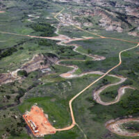 Oil pad access roads crossing Bennet Creek, three miles south of the North Unit of Theodore Roosevelt National Park