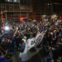 Chileans celebrate the results of the national plebiscite on setting up a Constitutional convention in October 2020. Photo: AS Chile